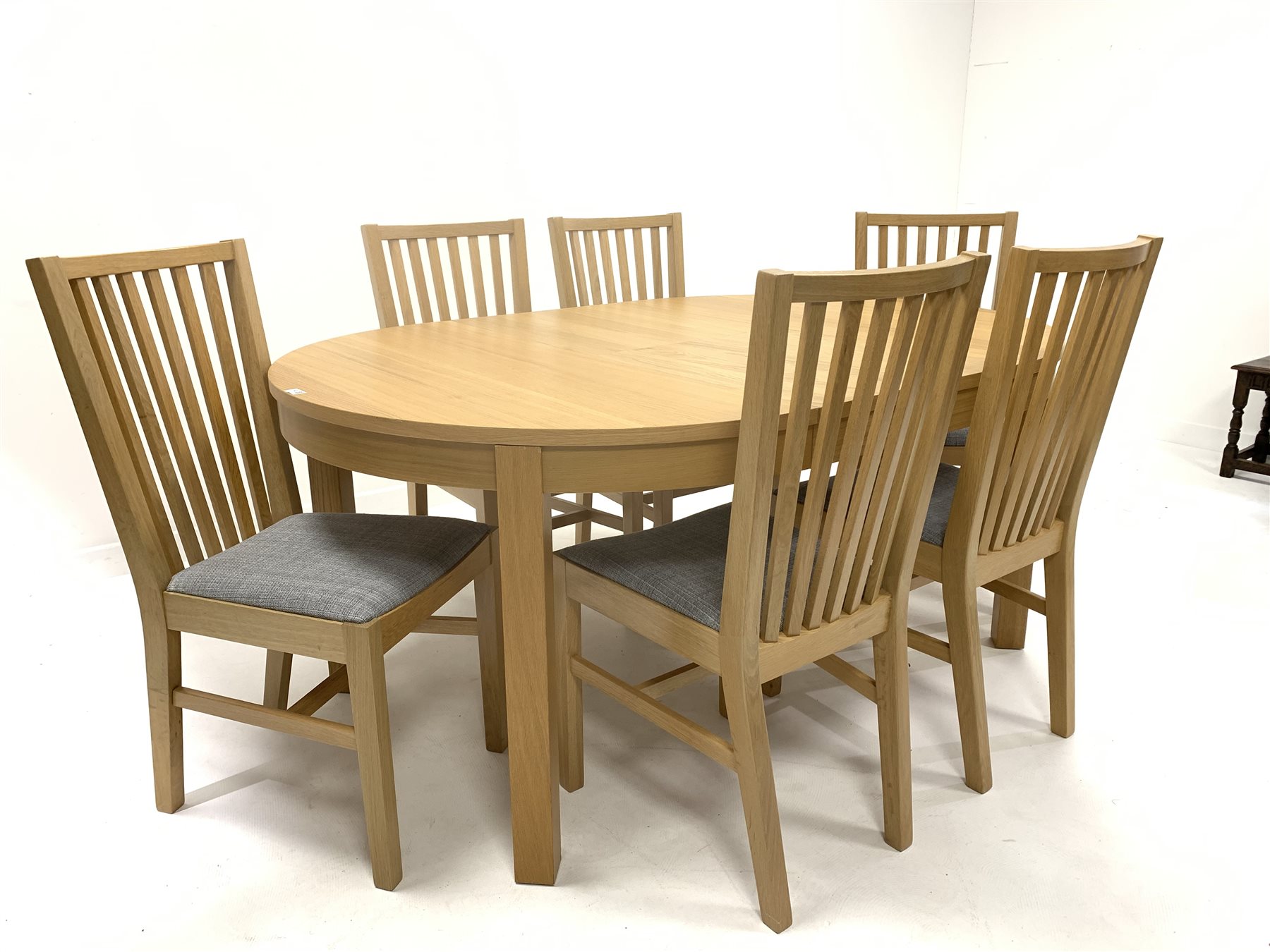 Ikea - Light oak oval extending dining table, with one fold away