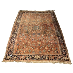 Persian design carpet, with geometric design on red field, guarded border, 254cm x 340cm