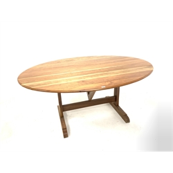 20th century French cherry wood Vineyard table, the oval top raised on joined base with 'V' shaped pivoting tilt top action, raised on shaped sledge feet