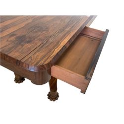 William IV rosewood centre table, rectangular top fitted with two mahogany lined drawers, raised on a tapered column with moulded lappet collar, on a quadruform platform base terminating in lappet carved feet with castors
