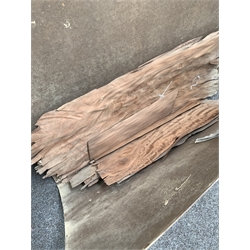 Quantity of wood veneers, some mahogany, in a folder