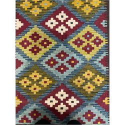 Maimana Kilim runner rug, the predominantly indigo field decorated with maroon and citrine lozenges with contrasting geometric ivory details