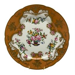William IV Rockingham porcelain cabinet plate c.1831–1842, centrally painted with a basket of flowers within shaped reserve, on burt orange ground, printed marks beneath 'Rockingham Works Brameld Manufacturer to the King', D26.5cm 