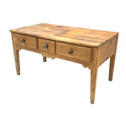 Victorian pine kitchen work table, fitted with three drawers over a shaped apron, raised on square tapered supports 