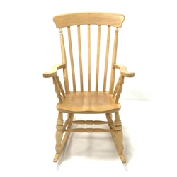 Beech Windsor style farmhouse rocking chair, with broad arms, dished seat, ring turned supports and double 'H' stretcher, W63cm