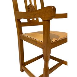 Knightman - set six oak dining chairs, open and pierced back carved with Yorkshire rose, tan leather upholstered seat with studwork, on octagonal front supports joined by plain stretchers, four side chairs and two carvers, by Horace Knight of Balk, Thirsk