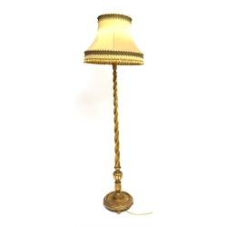 20th century gilt barley twist standard lamp on circular moulded base with turned feet, together with shade, H156cm (measurement excluding shade and fitting) 