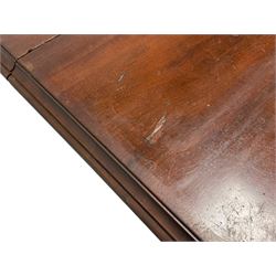 Large 19th century mahogany dining table, rectangular top with rounded corners and moulded edge, telescopic extending action with three additional leaves, on scroll carved cabriole supports with recessed brass castors, central turned support