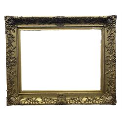 Early 20th century large gilt picture frame with flower head and foliate design, aperture 46cm x 61cm