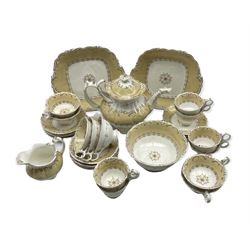 Victorian tea set decorated with a centre panel within a cream and scroll moulded border comprising six coffee cups, six tea cups, twelve saucers, tea pot, milk jug, slop bowl and two cake plates, pattern 834.  The ring and spur handles are similar to Coalport examples. 