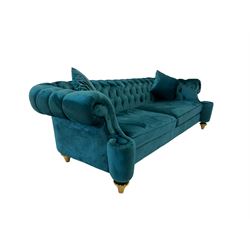 Chesterfield style three seat sofa, scrolled arms and uprights, upholstered in buttoned teal velvet, on turned tapering brass finish feet