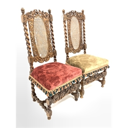 Pair of 19th century Carolean style walnut chairs, spiral turned uprights enclosing oval cane panels to the back rest, floral tassled velvet upholstered seat, raised on spiral turned supports and stretchers, profusely carved throughout with cherubs, eagles and floral scrolls  
