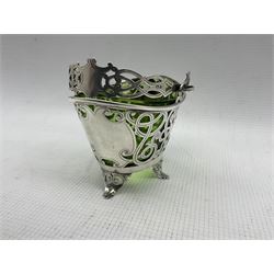 Edward VII silver boat shape sugar basket with pierced and scroll decoration, vacant cartouches and swing handle with green glass liner L11cm Birmingham 1901 Maker Levi & Salaman