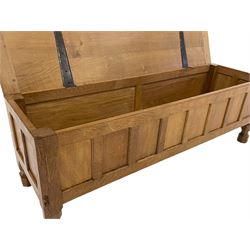 'Mouseman' oak blanket chest, rectangular adzed hinged lid over panelled front, panelled sides and back, on octagonal feet, by Robert Thompson of Kilburn 