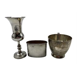 Silver Kiddush cup with engraved decoration H13cm London 1921, silver flask cup and a silver christening mug with inscription H7cm 8oz