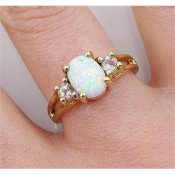 9ct gold three stone oval opal and white topaz ring, hallmarked 