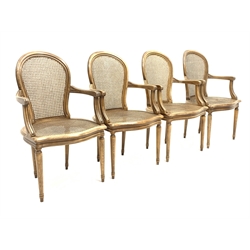 Set four French style bergère open armchairs, moulded beech frames, curved cane work backs and serpentine seats, turned supports, 