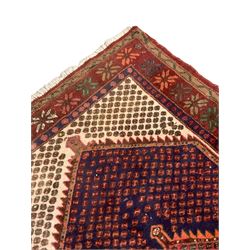 Persian Hamadan rug, extended lozenge field decorated with small stylised motifs and central medallion, floral design border