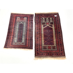  Afghan Belouch prayer rug, central mihrab panel enclosed by guarded border, (80cm x 146cm) together with another similar rug, (77cm x 120cm)  