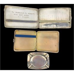 Engine turned silver cigarette case Birmingham 1926, silver ashtray with inscription and a North African engraved cigarette case, unmarked but tests as 900 standard