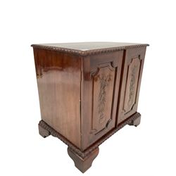 Mahogany low cupboard hi fi cabinet, the top with gadroon moulded edge over two panelled doors with floral carving, raised on bracket supports W71cm