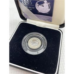 Queen Elizabeth II 2005 silver proof one ounce Britannia, 2005 silver proof twenty pence Britannia, both cased with certificates, 2004 silver bullion one ounce Britannia, on card, ten 1986 two pound coins and twenty commemorative crowns
