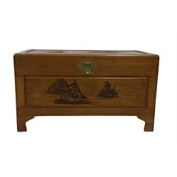 Singapore carved camphor wood blanket chest, rectangular top enclosing removable tray, decorated with carvings of traditional pagoda and ship scenes