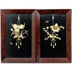 Pair of Japanese Meiji period framed black lacquer panels depicting similar hanging displays of carved bone ikebana with butterflies, 46cm x 70cm