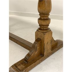 Early 20th century oak dining table, rectangular top raised on turned supports leading to sledge feet, 214cm x 70cm, H76cm
