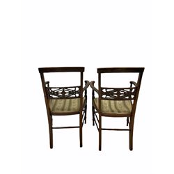 Pair of Edwardian inlaid mahogany elbow chairs, with upholstered seats, raised on turned supports and stretchers