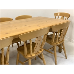 20th century varnished and stained pine farmhouse dining table, rectangular top raised on turned supports and fitted with two drawers, with a fitted heat mat (214cm x 104cm, H79cm) together with a set of eight (6+2) beech farmhouse dining chairs, shaped crest rail, spindle and splat back, saddle seat, raised on ring turned supports 