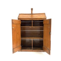 Late 19th century varnished pine two door cupboard, loosely formed as a dolls house, the interior fitted with shelves, W70cm, H109cm, D46cm