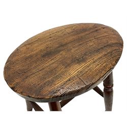 19th century elm and beech stool, oval seat on four turned supports joined by swell turned stretchers (H49cm); and a similar smaller stool (H45cm)
