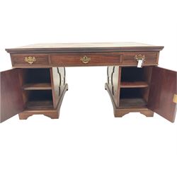 19th century and later mahogany partners desk, moulded rectangular top with leather inset decorated with Greek key border, the top fitted with three drawers to each side, each pedestal fitted with three drawers and cupboard, with quatrefoil panelled doors and sides, raised on bracket feet Provenance:  3rd Earl of Feversham