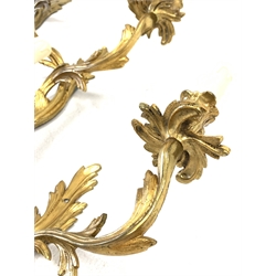 Set of four modern gilt brass two branch wall lights of rococo design, height of backplate 36cm, 