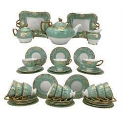 Royal Crown Derby bone china Vine pattern tea service for twelve persons, on a turquoise ground, comprising teapot, twelve teacups and saucers, sugar bowl, milk jug, side plates and two sandwich plates (Qty)