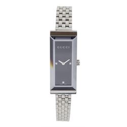 Gucci stainless steel quartz ladies wristwatch, Ref 127.5, black dial with diamond hour markers at 3, 6 and 9 o'clock, boxed with additional links