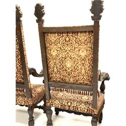  Pair of late 19th / early 20th century  Italian carved walnut high back chairs, each with gilt acanthus carved pediments over upholstered seat and back panels, scrolled arms, raised on leaf carved block supports, W85cm  