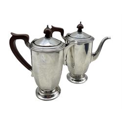 Silver small  coffee pot and matching hot milk jug of panel sided design with stained wood handles and lifts H17cm Birmingham 1935 19.6oz gross and in original Mappin and Webb box