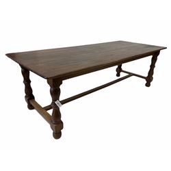 Late 19th/ Early 20th century oak country refectory dining table, five plank top over turned and block supports united by stretcher 230cm x 97cm, H75cm