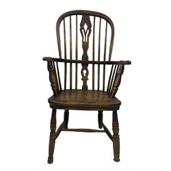 19th century Windsor chair, the spindle back over saddle seat, raised on turned supports 