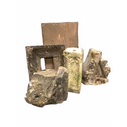 Four carved limestone architectural fragments, reputedly from York Minster, together with a York stone flag