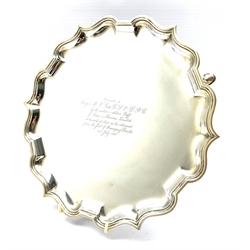 Silver circular salver with pie crust border, presentation inscription and on triple shaped supports D30cm Birmingham 1928 Maker Ellis & Co 26oz