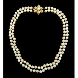 Double strand cultured pearl necklace, with a gold pearl set leaf cluster clasp