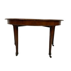 Early 19th century mahogany D end side table, semi-circular top over chamfered tapered supports terminating in brass castors 