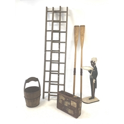 Two pairs of vintage wooden ladders, wooden and metal bound bucket, two vintage rowing awes, blackmoor stand and a leather suitcase with old labels