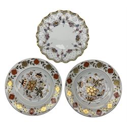 Three Royal Crown Derby plates comprising a pair of Asian Rose dinner plates no. 8687 D27cm and a Royal Antoinette pattern wavy rim plate (3)