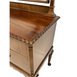 Mid-20th century mahogany dressing chest, tapered horns with gadroon carved finials, bevelled swing mirror in moulded frame with shaped top, rectangular top with gadroon carved edge, fitted with two short drawers and one long drawer over shaped apron, on gardroon and c-scroll carved cabriole supports