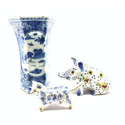 19th century Delft vase painted with deer in a landscape, H19cm, Delft posy vase modelled as a seated pig and a Delft model of a cat (3)