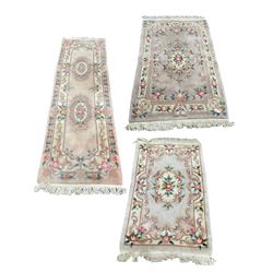 Three Chinese washed woollen rugs, including one runner 